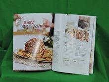 Load image into Gallery viewer, Cook Books - Kraft Kitchens "What's Cooking" - 2009 - Festive Issue