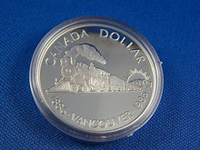 Load image into Gallery viewer, Currency - Canadian Coin - $1 - 1986 - Royal Canadian Mint - 100th Anniversary of the Inauguration of the Transcontinental Railroad and the Centenary of the City of Vancouver.
