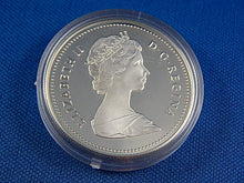 Load image into Gallery viewer, Currency - Canadian Coin - $1 - 1986 - Royal Canadian Mint - 100th Anniversary of the Inauguration of the Transcontinental Railroad and the Centenary of the City of Vancouver.
