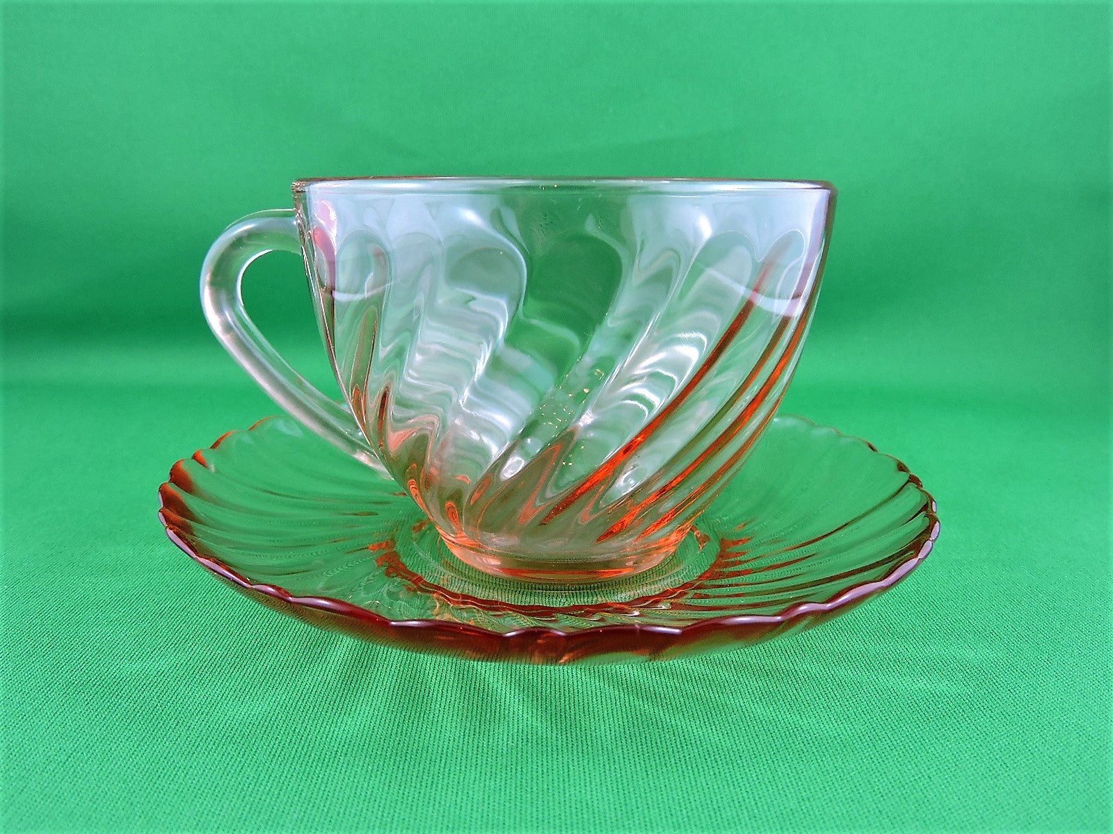 Arcoroc pink glass tea cups and saucers