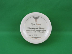 Nursing and Caring Heirloom Porcelain Music Box Collection - 2002 - "Care Giving"